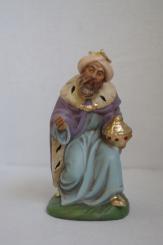 König braun, kniend 