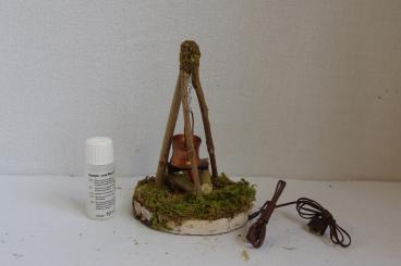 Hirtenfeuer auf Birkenscheibe mit Rauch 