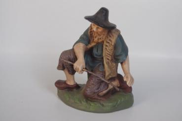 Hirte kniend am Feuer 