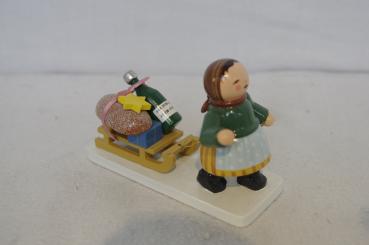 Mädchen mit Schlitten 